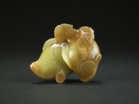 Lot 201 - A Chinese pale green and russet nephrite jade...