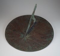 Lot 219 - An early 20th century patinated sundial in...