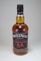 Lot 241 - A bottle of White and Mackay Special blended...
