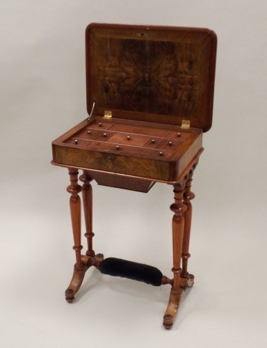 Lot 294 - A Victorian figured walnut work table, the...