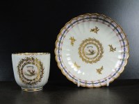 Lot 18 - A Caughley polychrome coffee cup and saucer,...