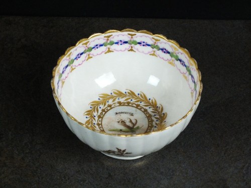 Lot 24 - A Caughley polychrome tea bowl, circa 1792-94,...