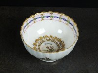 Lot 24 - A Caughley polychrome tea bowl, circa 1792-94,...