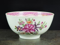 Lot 25 - A Caughley polychrome tea bowl, circa 1785-90,...