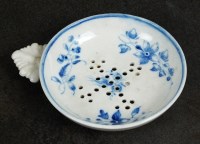 Lot 75 - Caughley egg drainer, circa 1782-92, with leaf-...