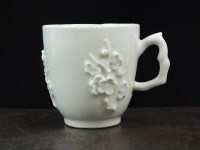 Lot 221 - A Bow 'blanc de chine' coffee cup, circa 1760,...