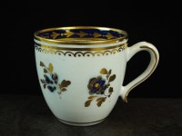 Lot 224 - A Caughley coffee cup, circa 1795, painted in...
