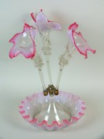 Lot 307 - A Victorian cranberry glass epergne, the...