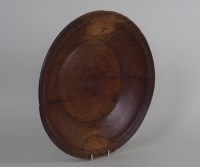 Lot 335 - An 18th century turned fruitwood alms dish...