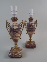 Lot 339 - A pair of French rouge marble table urns, in...