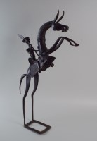 Lot 341 - A brown patinated bronze stylised figure of a...