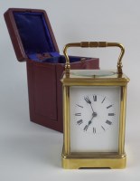 Lot 385 - A late 19th century brass carriage clock, the...