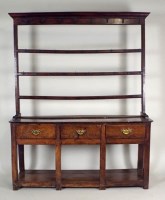 Lot 387 - An 18th century oak high dresser, the moulded...