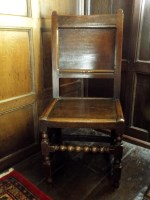 Lot 393 - A William III oak back stool, the single panel...