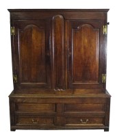 Lot 395 - An 18th century oak livery cupboard, the...