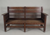 Lot 409 - An oak Arts and Crafts settle, the double bar...