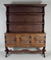 Lot 410 - A 20th century oak high dresser, with carved...