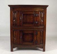 Lot 424 - An 18th century oak food hutch, the moulded...