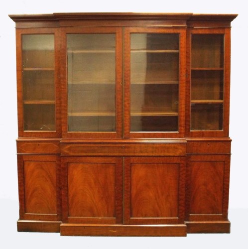 Lot 433 - A 19th century mahogany breakfront bookcase...
