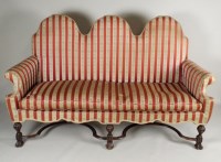 Lot 443 - A George I style walnut triple camel back sofa,...