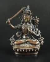 Lot 132 - A Chinese Tibetan bronze figure of the goddess...