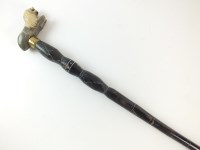 Lot 135 - A sectional horn walking cane, with carved...