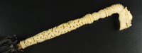 Lot 164 - A black silk parasol with Chinese carved ivory...