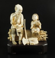 Lot 165 - A Japanese ivory okimono of a woodsman sitting...