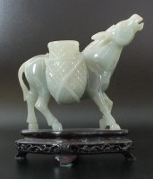 Lot 177 - A Chinese carved mutton fat jade donkey, 20th...