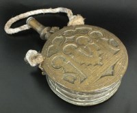 Lot 218 - A Moroccan brass powder flask, late 19th/...