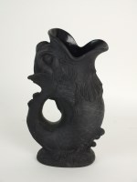 Lot 63 - A Wedgwood black basalt gurgle or fish jug,...