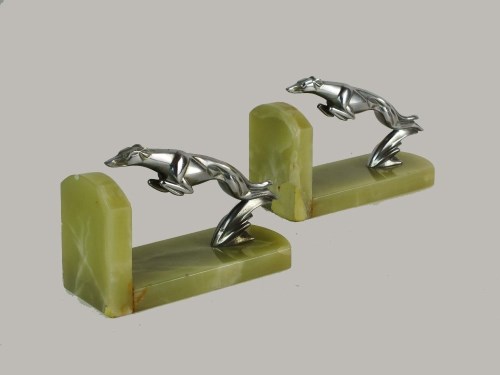 Lot 180 - A pair of Art Deco bookends, the stylised...