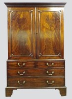 Lot 194 - A George III mahogany linen press, the dentil...