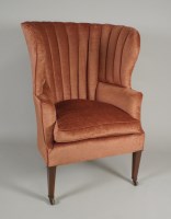 Lot 215 - An early 19th century mahogany winged armchair,...