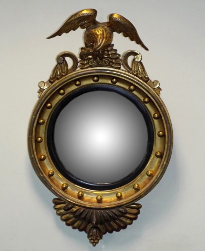 Lot 228 - A Regency style gilt wood convex wall mirror,...