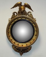 Lot 228 - A Regency style gilt wood convex wall mirror,...