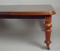 Lot 242 - A Victorian mahogany wind-out dining table on...