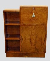 Lot 250 - An Art Deco figured walnut veneered low bureau...