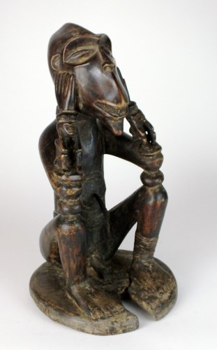Lot 16 - A Cameroons Grassland figure with monkey face...