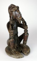 Lot 16 - A Cameroons Grassland figure with monkey face...