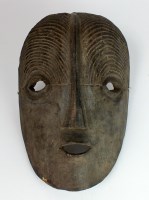 Lot 25 - A Congolese wooden mask in the Luba style with...