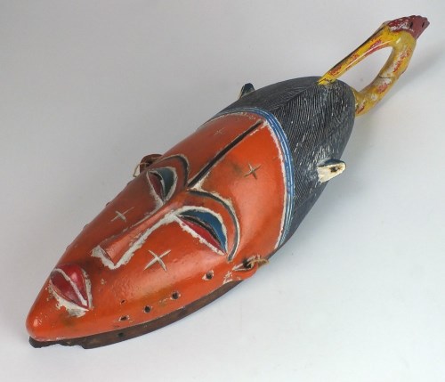 Lot 28 - A West African Guro tribe painted mask from...
