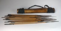 Lot 36 - An African leather quiver with 24 metal tipped...