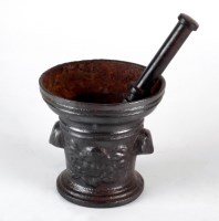 Lot 109 - A 19th century cast iron pestle and mortar in...