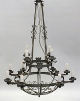 Lot 110 - An early 20th century wrought iron two tier...