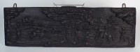 Lot 135 - A 17th century dark stained oak panel carved...