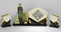 Lot 160 - An Art Deco onyx and marble figural clock...