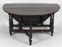 Lot 193 - An early 18th century oak gate-leg dining table.