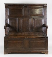 Lot 199 - An 18th century joined oak box seat settle,...