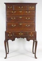 Lot 200 - A mid 18th century oak chest on stand, the...